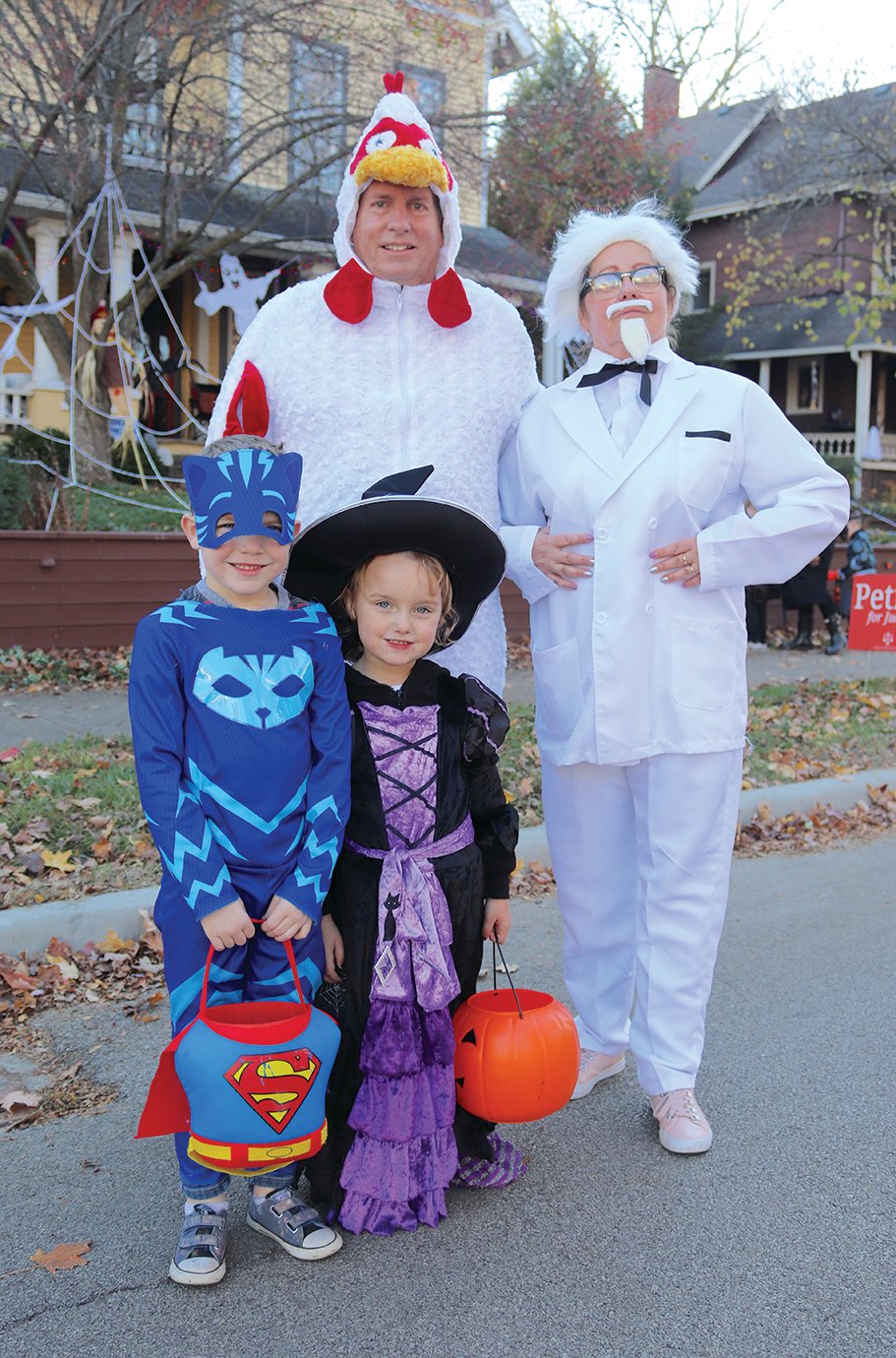 Robert and Olga Brown and grandchildren Conner Brown, 6, and Claira Brown, 4, mosey down Main on Halloween.